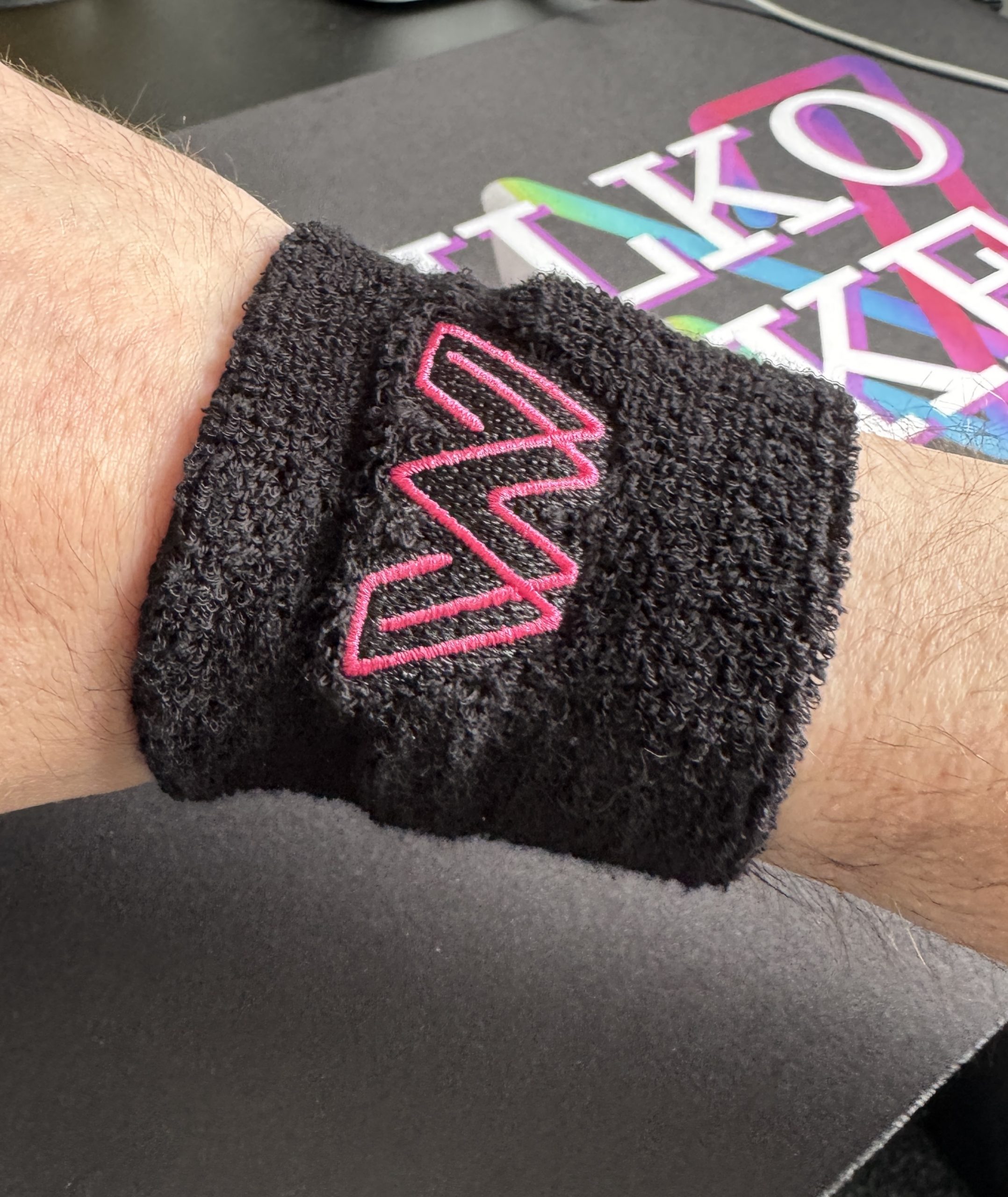 Black Sweatband with pink embroidered WW logo